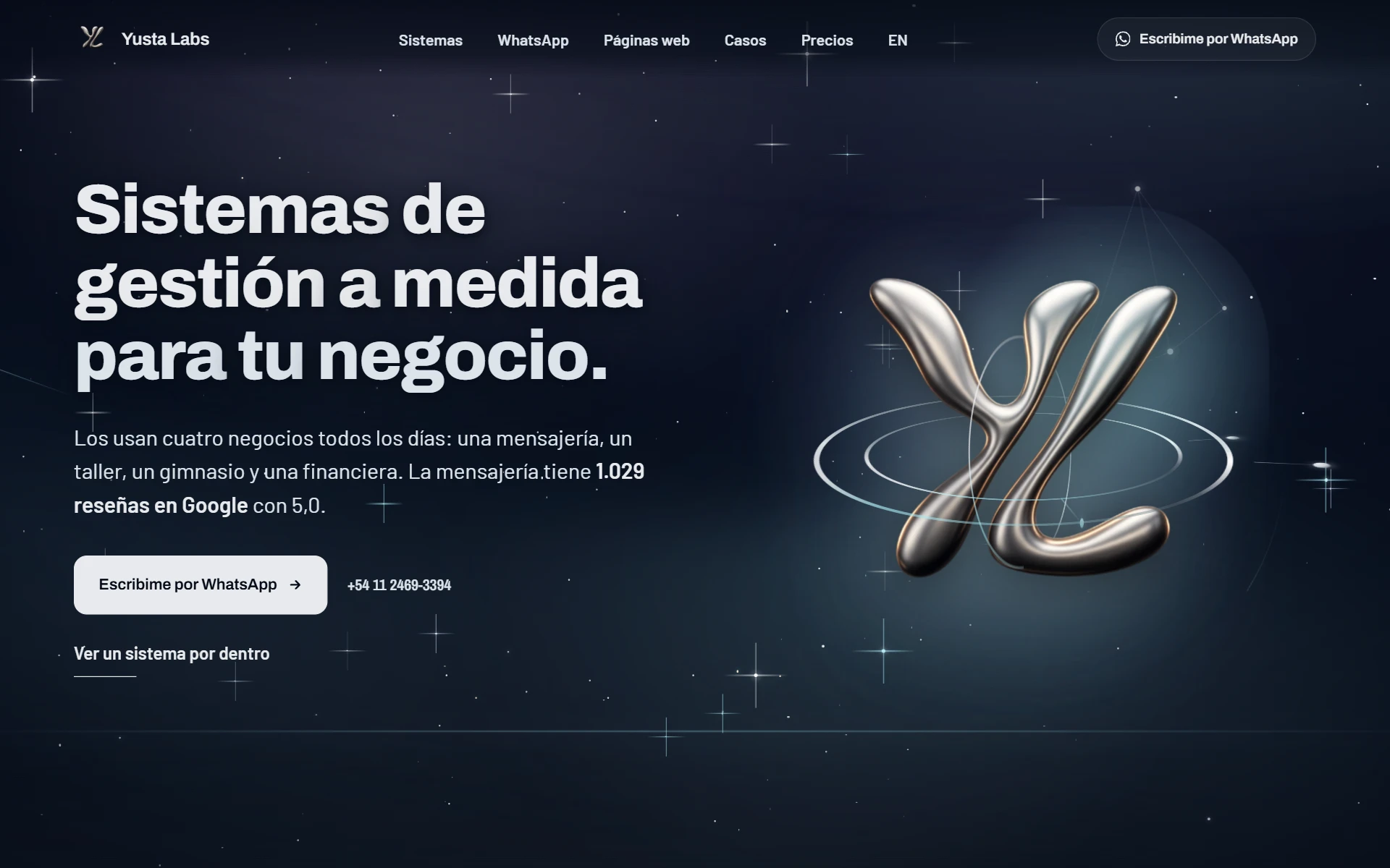 The yustalabs.com home page: the headline, the WhatsApp button and the YL monogram over the starry sky
